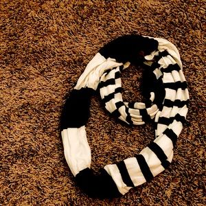 A black and white scarf /wrap never worn great condition has tag on it